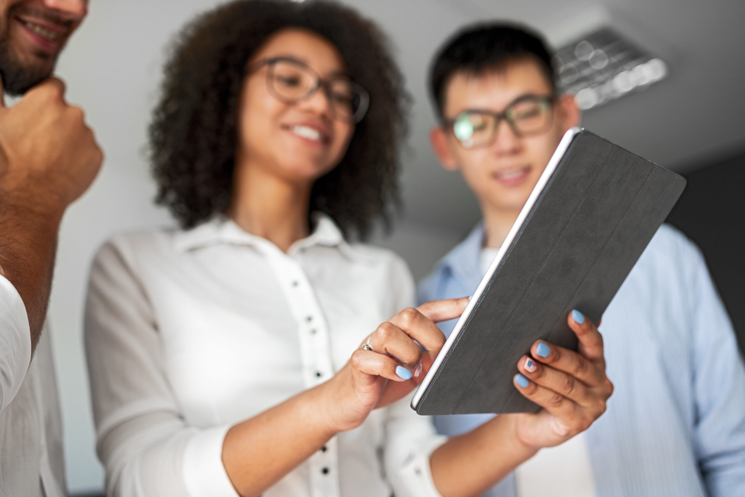 Group of People Viewing a Tablet